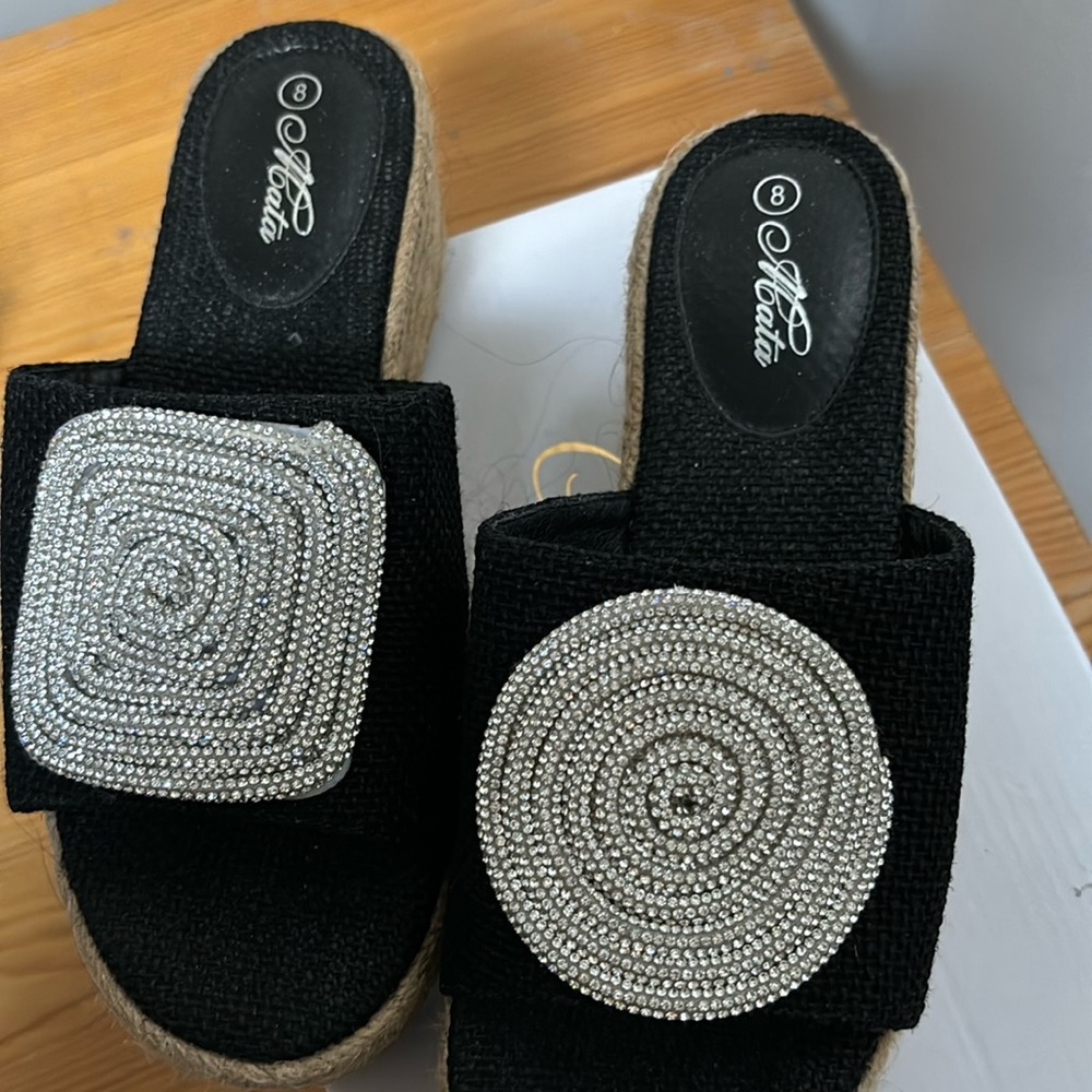 Gorgeous black wedges with unique rhinestone tops. Size 8
